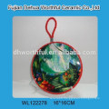 Round ceramic pot holder with blue lifting rope